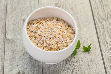 Raw oats in the bowl