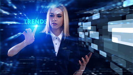 Business, Technology, Internet and network concept. Young businessman working on a virtual screen of the future and sees the inscription: Trends