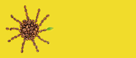 Coffee beans are laid out in the shape of sun on a yellow background. Creative morning concept for coffee shops, cafes. Top view, flat lay, copy space...