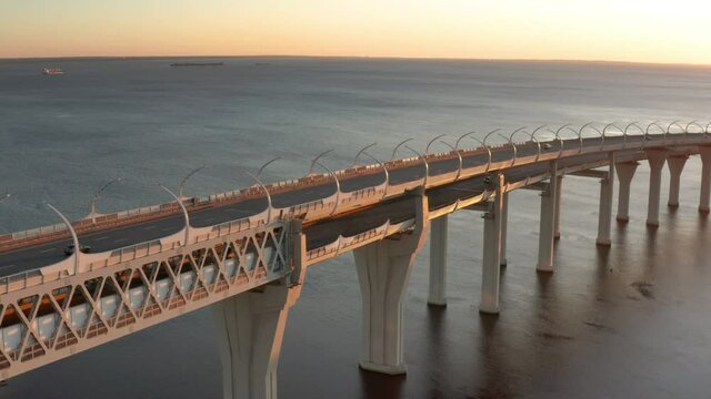 High-speed toll road, highway bypassing the city center St. Petersburg, the central section of the western high-speed section. A beautiful view of the sunset over the Gulf of Finland.