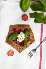 Strawberry galette with basil and pistachio 