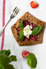 Strawberry galette with basil and pistachio 