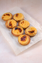 Traditional Portuguese popular dessert Pastel de nata or Pastel de Belem. Delicious puff pastry cups with custard. Gastronomic travel in Portugal.