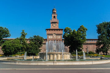 Sforza castle (Castello Sforzesco, XV century) and huge medieval walls in Piazza Castello (Castle square). Milan, Italy.