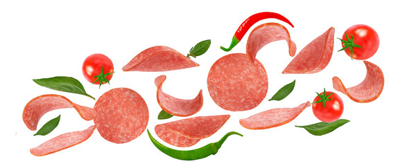 salami slices, tomatoes and basil on a white background