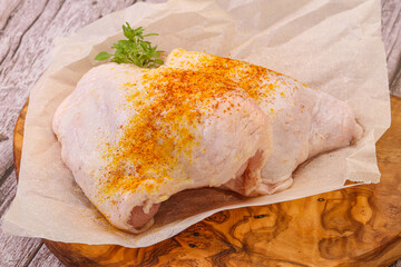 Raw chicken thigh with spices