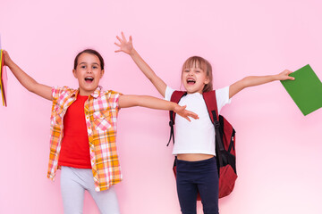 happy little girls with classmates having fun at the School