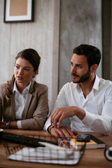 Businessman and businesswoman in office. Businesswoman and businessman working on the project