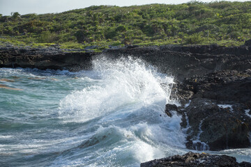 waves crashing on rocks