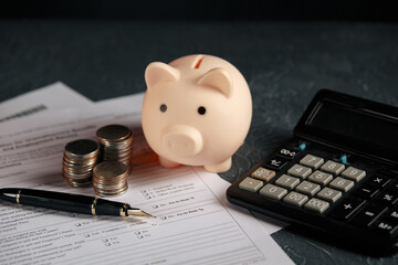 Close up woman hand using calculator and writing make note with calculate about cost at home office.