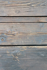 old wooden Board with a beautiful texture and knots as background.