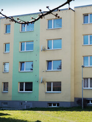 White window on a brown concrete wall of a building