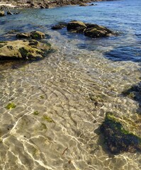 rocks and clear water on the beach