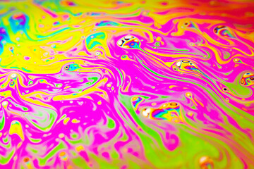 Beautiful psychedelic abstraction formed by light on the surface of a soap bubble