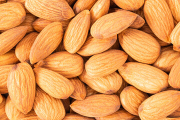 Almond background texture. Background of raw almond nut located randomly