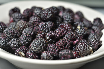 black raspberries close-up on plate
