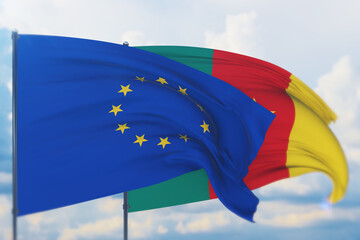 Waving European Union flag and flag of Cameroon. Closeup view, 3D illustration.