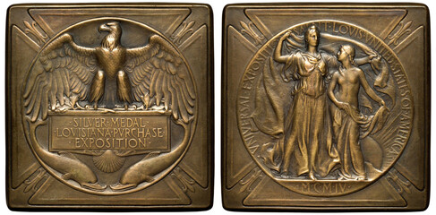 Unites States US square medal of Louisiana Purchase Exposition in Saint-Louis in 1904, eagle on bas-relief, two dolphins below, Liberty covering woman with American flag, radiant sun below, 