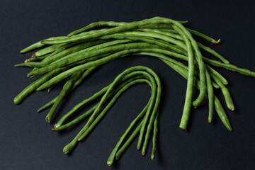 green beans on a black background. Harvesting. Home cooking