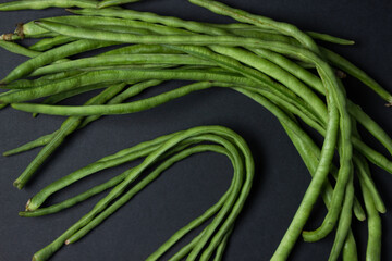 green beans on a black background. Harvesting. Home cooking