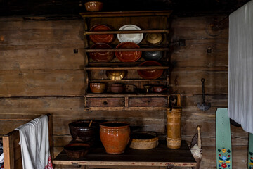 Fototapeta na wymiar the interior of an old house with old household items of the peoples of the north