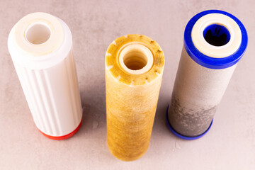 three filters on the table close-up after replacing dirty drinking water