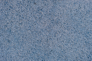 Blue synthetic tartan surface made of rubber granules. Abstract ruberrized texture as background