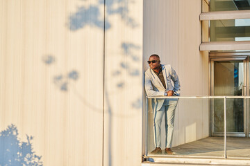 African American businessman at sunset in a building.