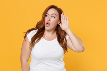 Shocked curious young redhead plus size body positive female woman girl 20s in white casual t-shirt...