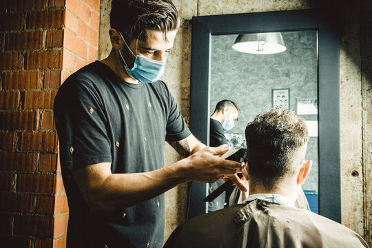 beautician and hairdresser working with mask for the covid19 virus