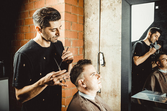 hairdresser and beautician working in her hair salon