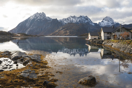 typical scandinavian house by the lake in autumn