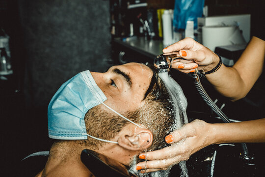 beautician and hairdresser working with mask for the covid19 virus
