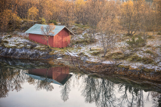 house on wooden port in a Norwegian fjord