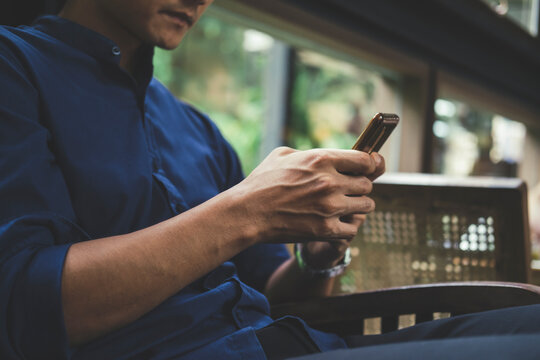 Close up of man using mobile phone.