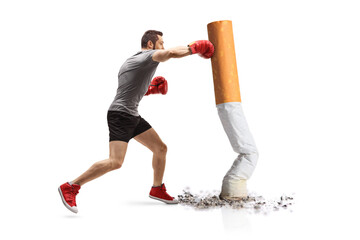Young guy punching with boxing gloves