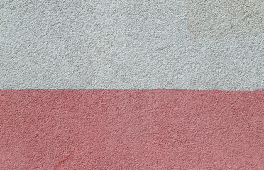 Texture of the decorative plasterwork painted in pink and white colors