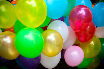 A lot of colorful balloons close-up views. Balloons of many colours. Colorful balloons background.