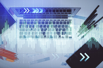 Multi exposure of forex graph drawing over desktop background with computer. Concept of financial analysis. Top view.