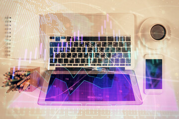 Stock market chart and top view computer on the table background. Multi exposure. Concept of financial analysis.