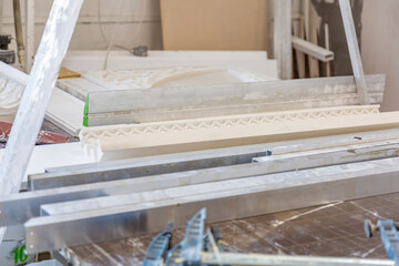 Fototapeta na wymiar Inside an industrial workshop of the Dikart gypsum stucco moulding plant. Moscow, Russia