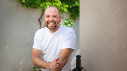 bearded bald man laughing