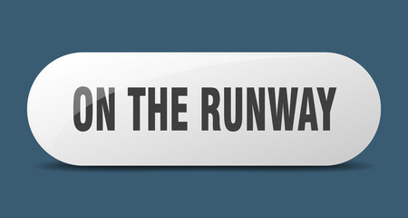 on the runway button. sticker. banner. rounded glass sign