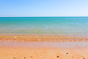 Soft Wave Of Blue Ocean On Sandy Beach. Background. Selective focus