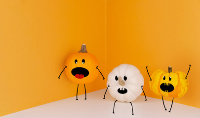 White and orange heirloom pumpkins with funny monster faces on orange background. Space for text. Halloween festival background concept. 31 october.
