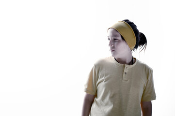 Serious and thoughtful young man, looking sideways, exploring, discovering or advancing. Illuminated, with white background and copy space.