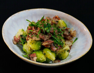 roasted brussel sprouts with beef bacon in a bowl
