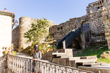 Turist wearing a mask in the new normal visiting a historical place