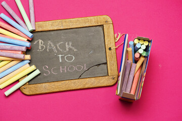 blackboard with back to school message with box of chalk. flat lay