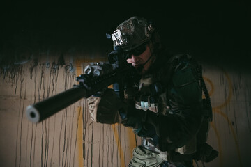 Soldier in full US MARSOC equipment entering abandoned building, aiming different angles with MK18 assault rifle